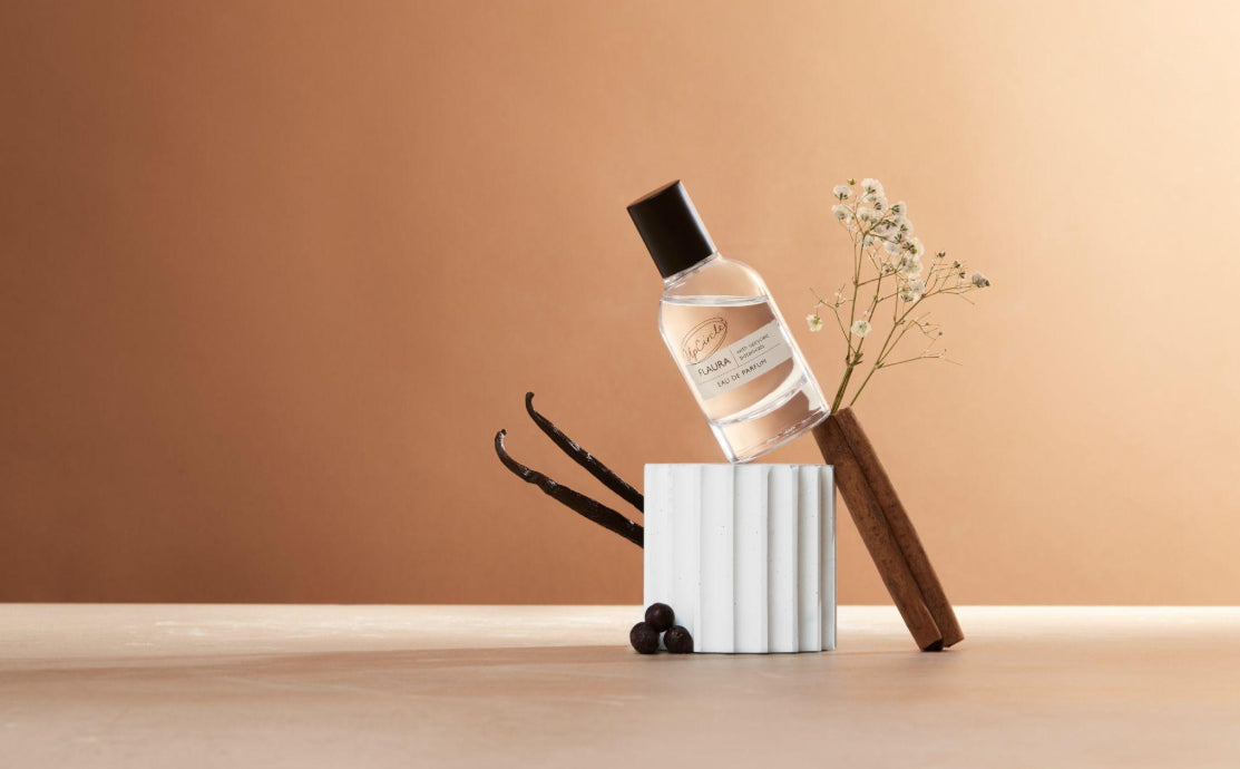 Natural perfume bottle styled with dried botanicals and vanilla pods, showing what natural fragrance is made from